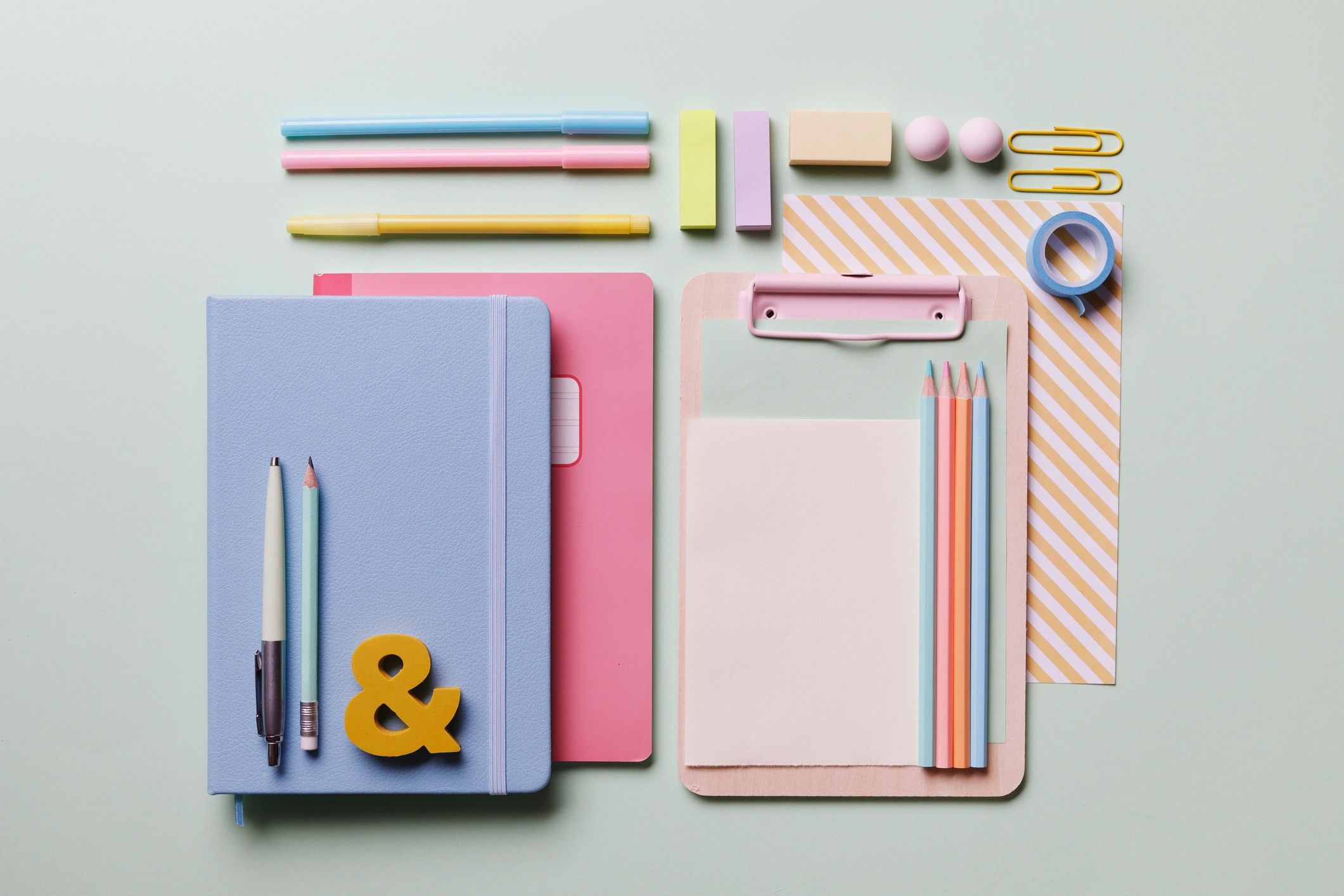 Colorful desk flat lay with paper and supplies