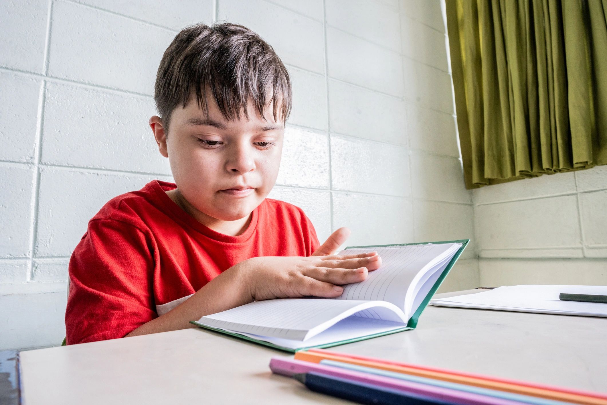 Child working on a printable worksheet at a desk
